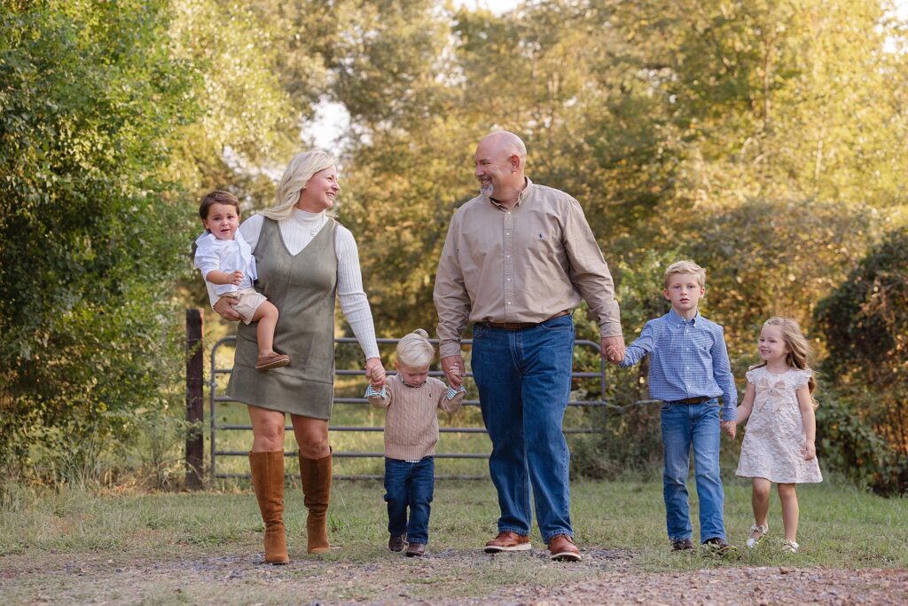 Grandparents walking with their grandchildren.