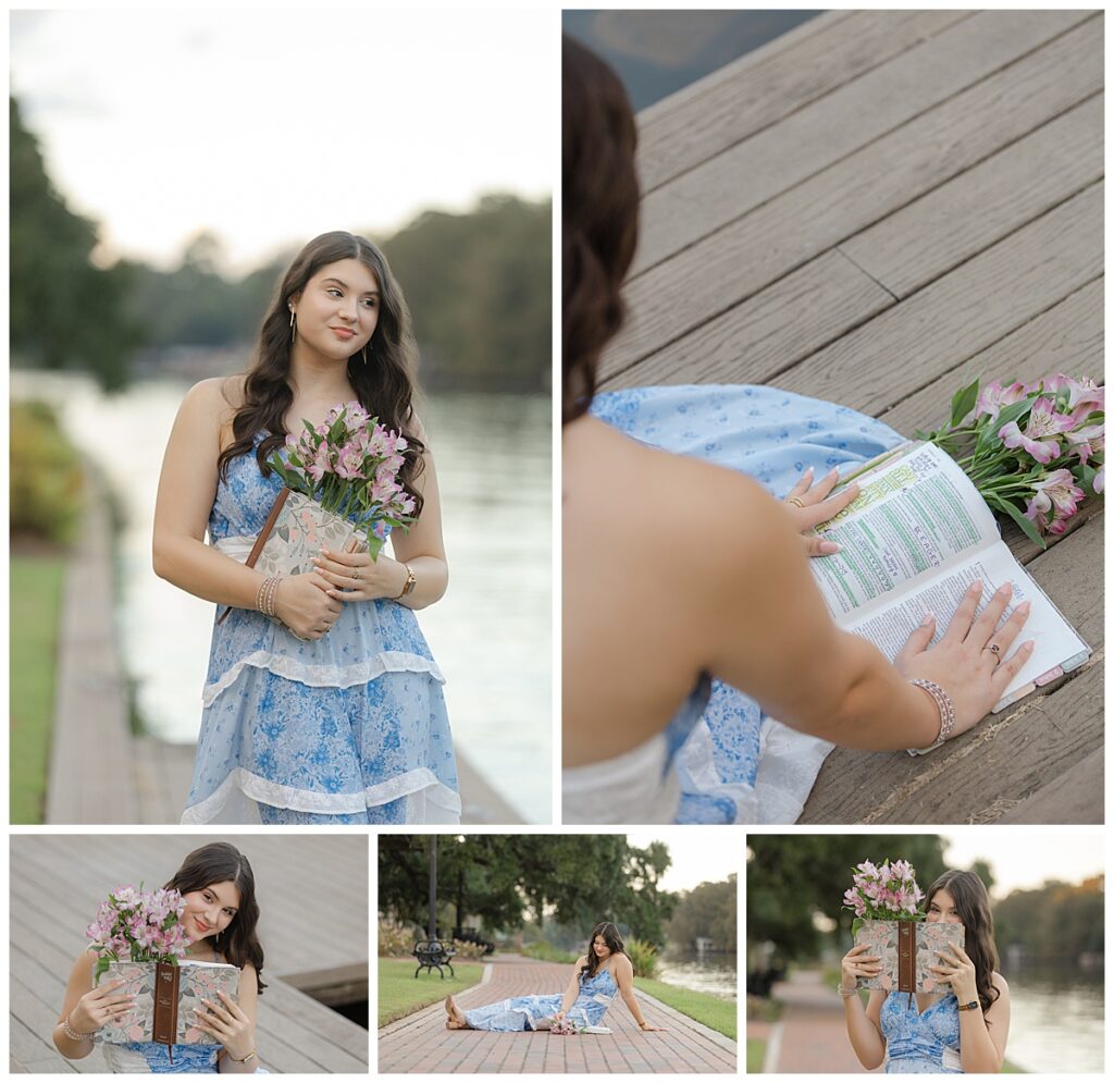 A girl holding her bible and flowers with a river background.