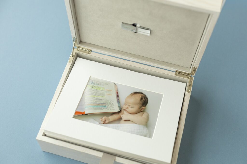 Memory box containing a framed newborn picture.