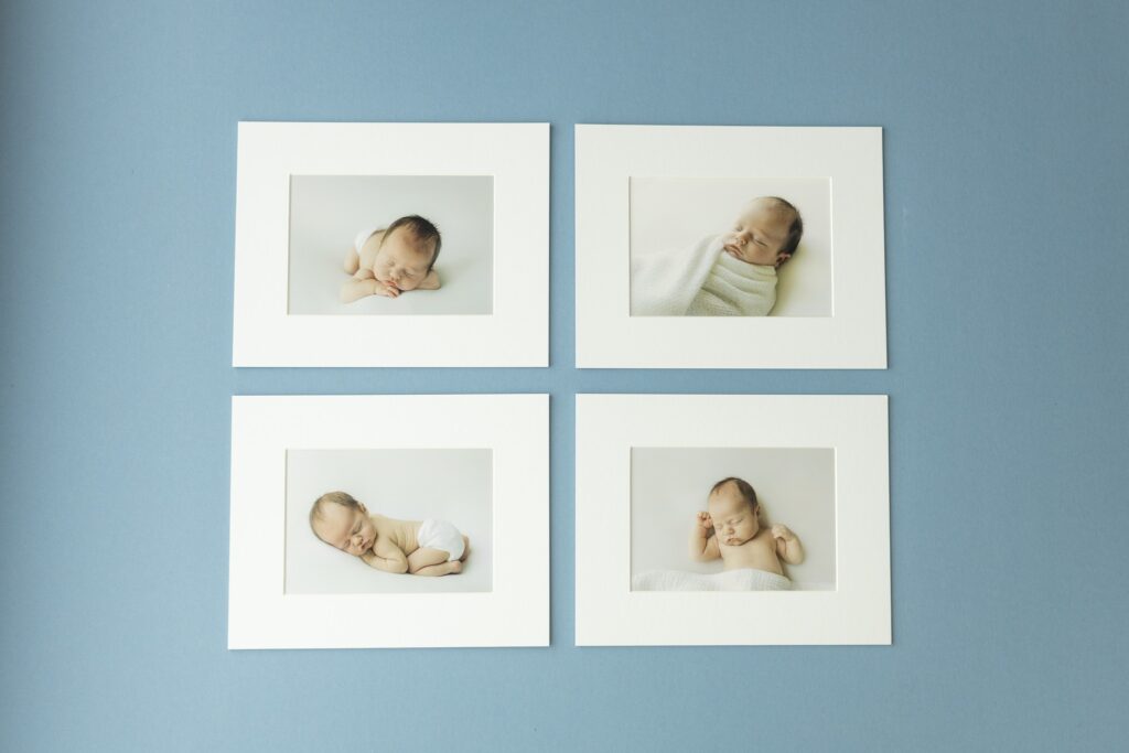 Arranged newborn framed photos.