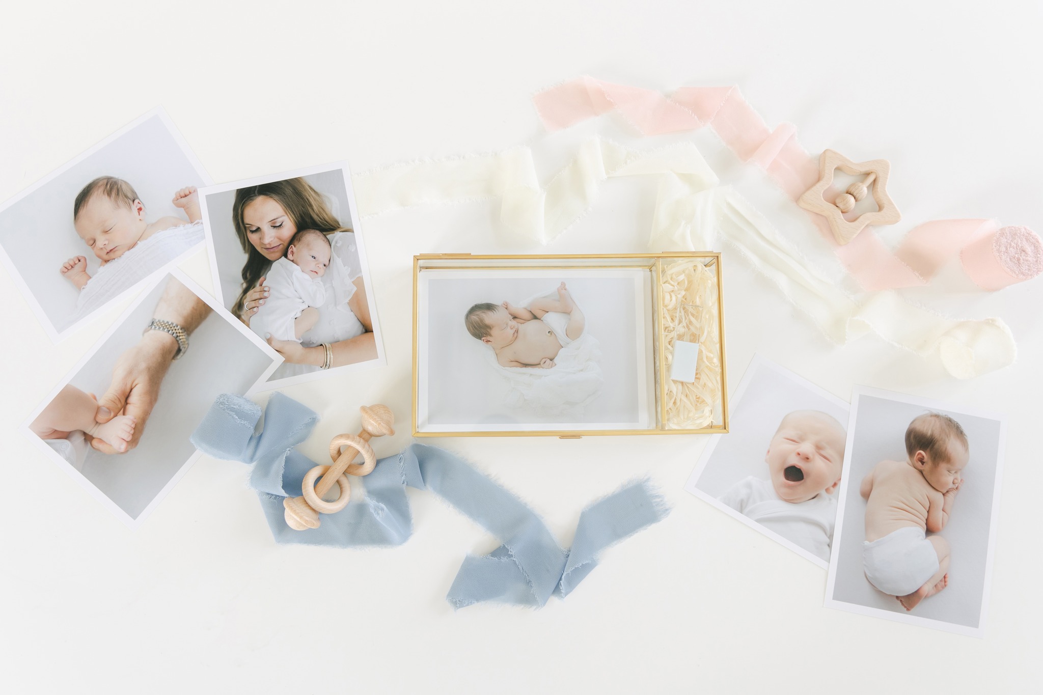 Flat lay of framed newborn photography in Shreveport