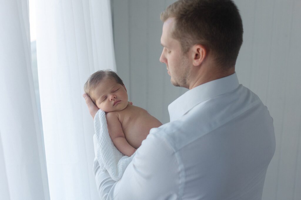 emotional newborn photography with dad Shreveport-Bossier