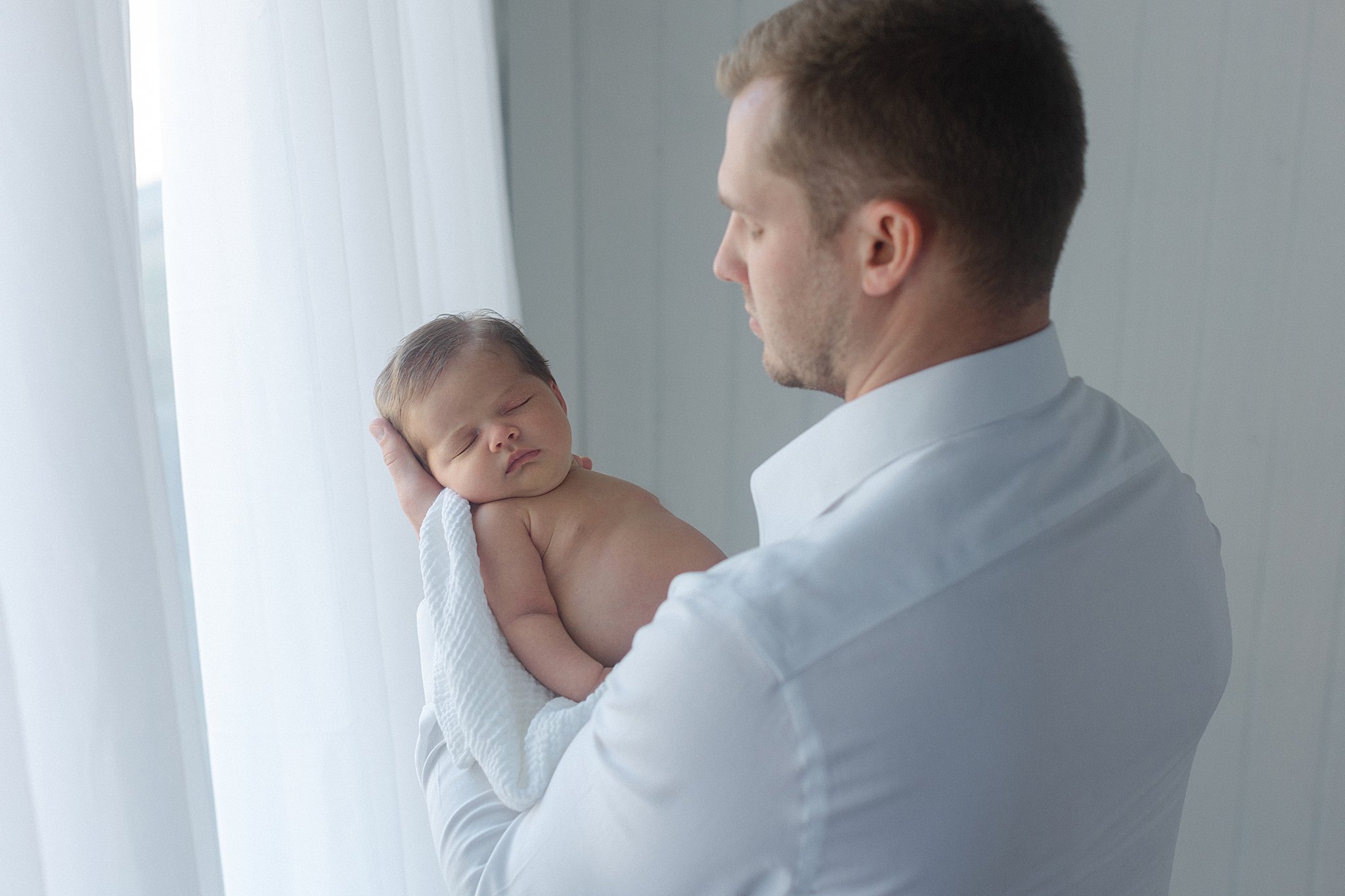 emotional newborn photography with dad Shreveport-Bossier