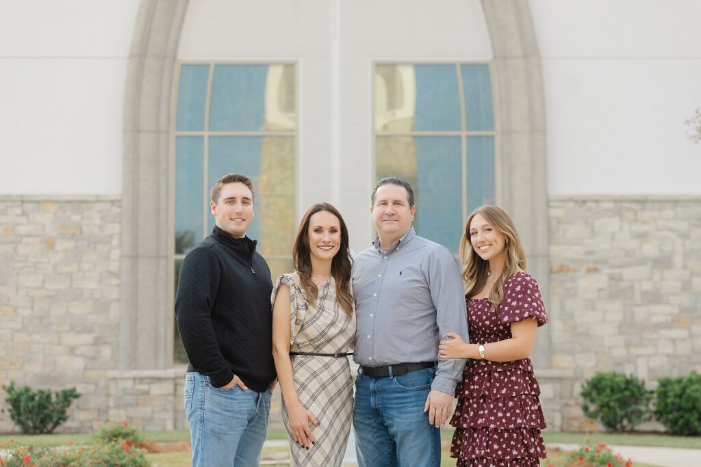 Family standing in front of church.
