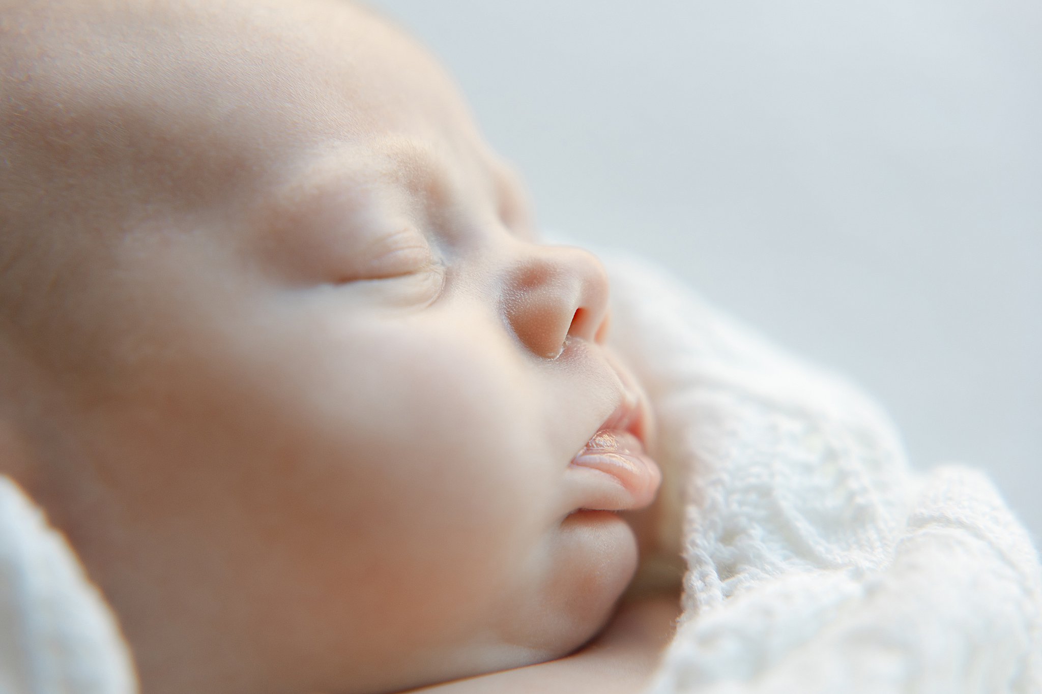 Newborn wrapped for photos during Shreveport newborn photography sessions